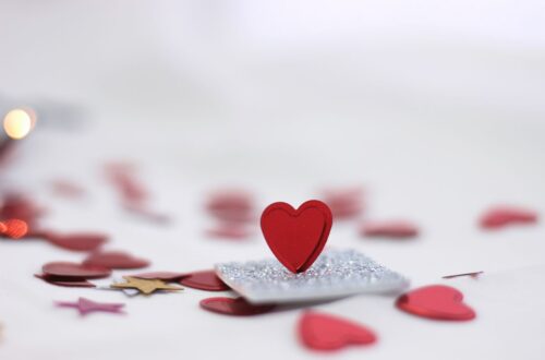 Elegant red heart on sparkly surface, ideal for Valentine's Day themes.