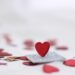 Elegant red heart on sparkly surface, ideal for Valentine's Day themes.