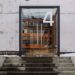 From below of modern building facade with number four on glass entrance door and stairs