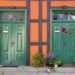 Charming green wooden doors in Stralsund, Germany, showcasing traditional architecture.