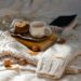 Warm knitted sweater with coffee and cookies, perfect for a cozy morning.